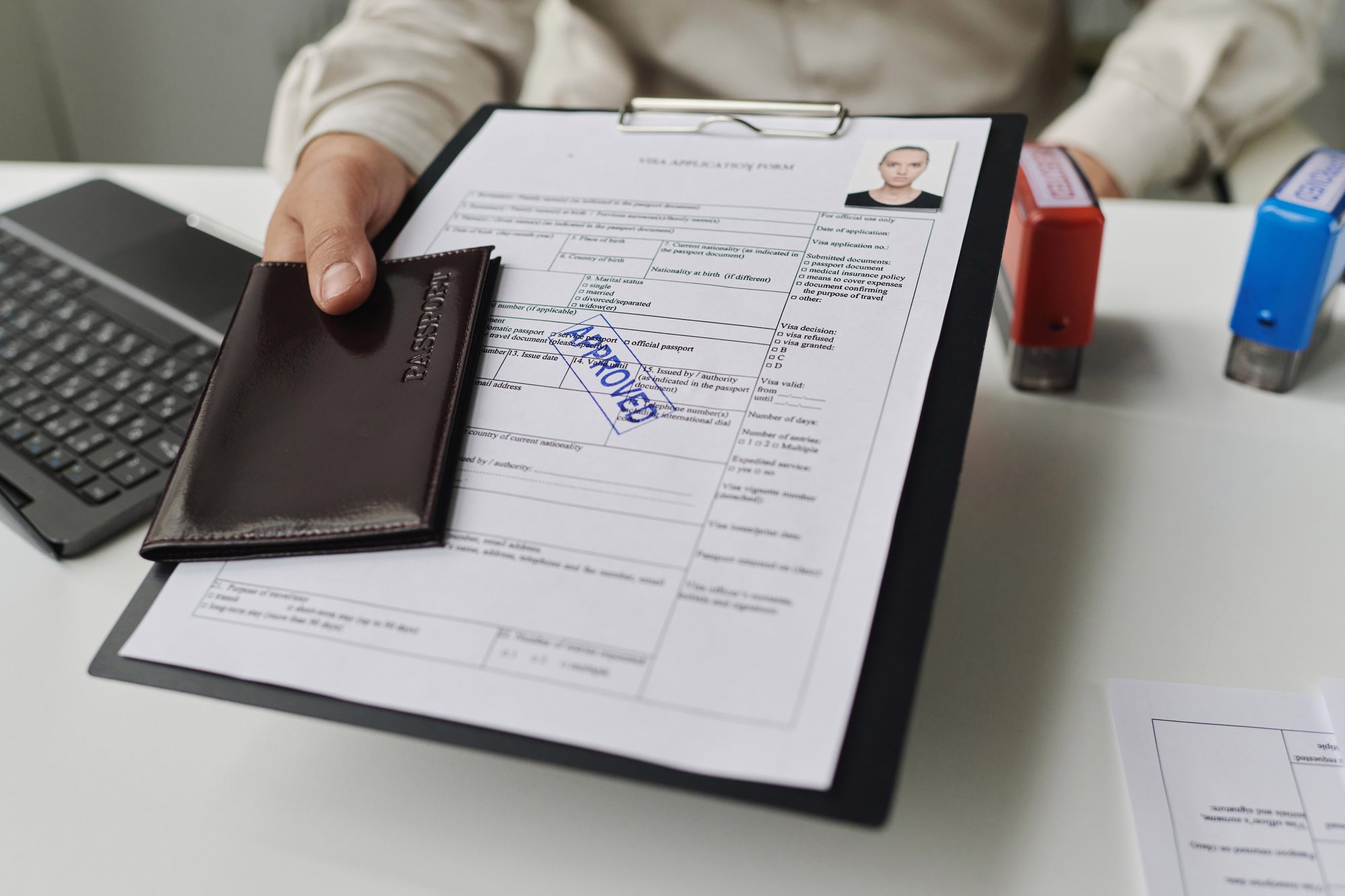 A Prestige Solutions specialist handing over approved documents