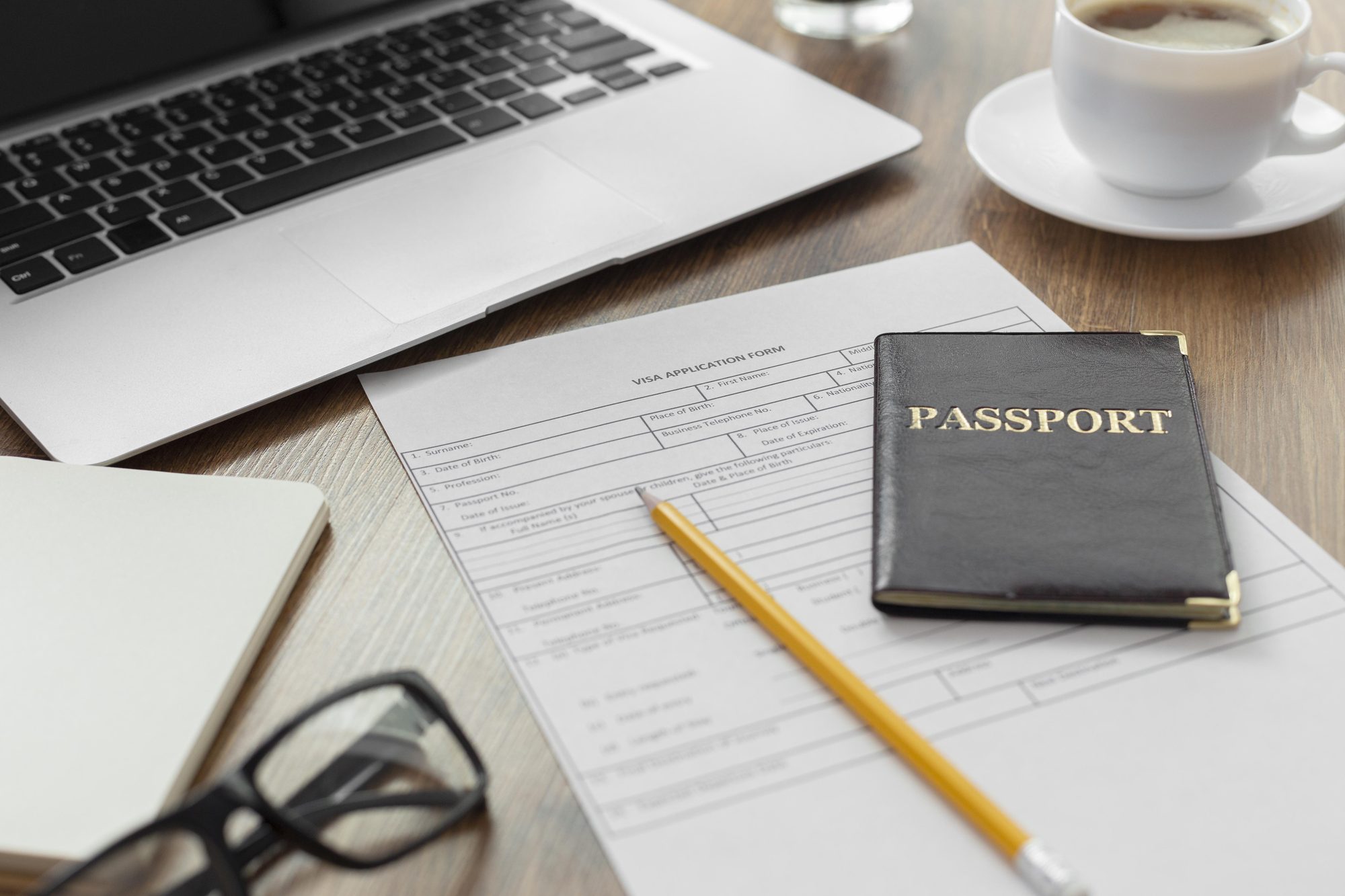 Prepared UK visa application documents and passport on a desk