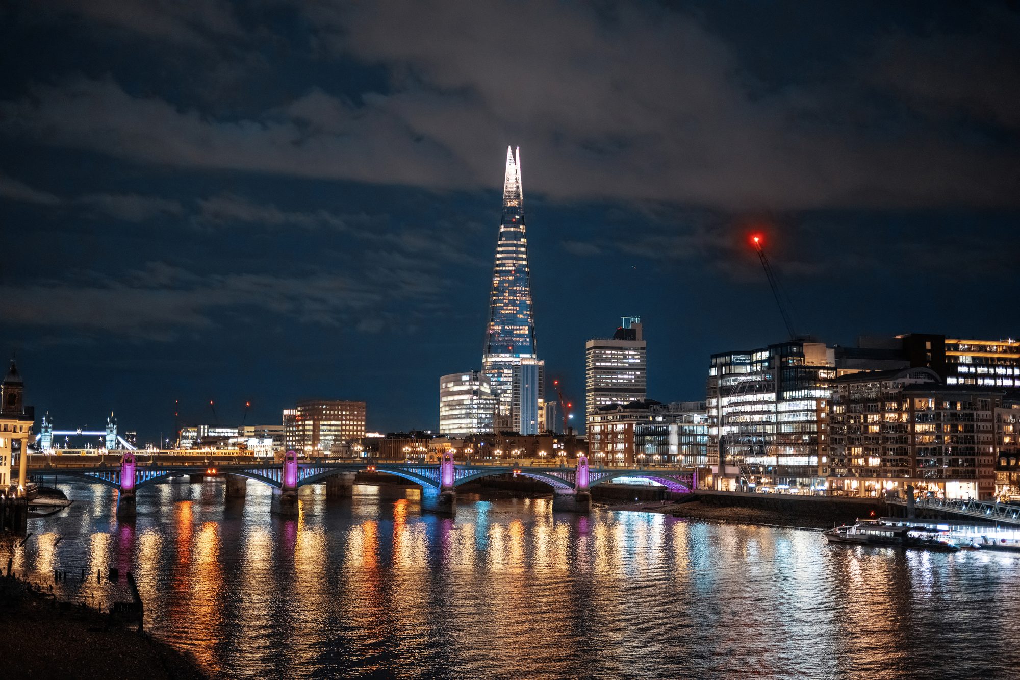 London city skyline at night with the Thames and The Shard
