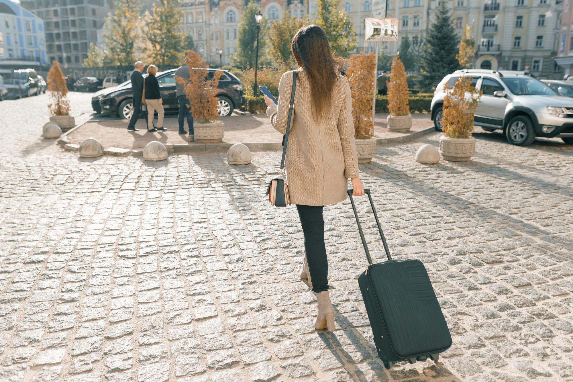 Traveller with a suitcase on a European city street