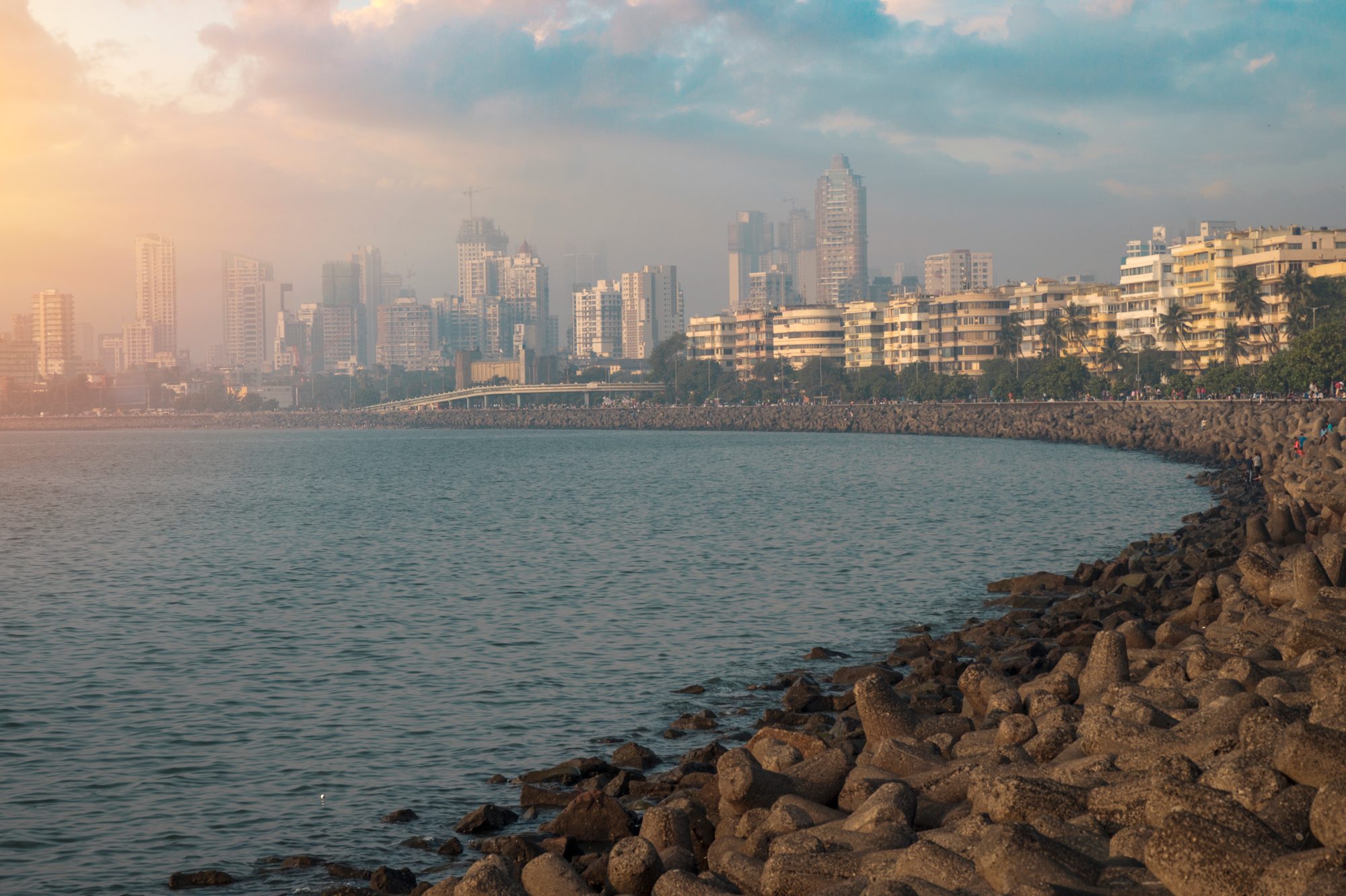 Marine Drive in Mumbai curving around the bay, with the city skyline beyond
